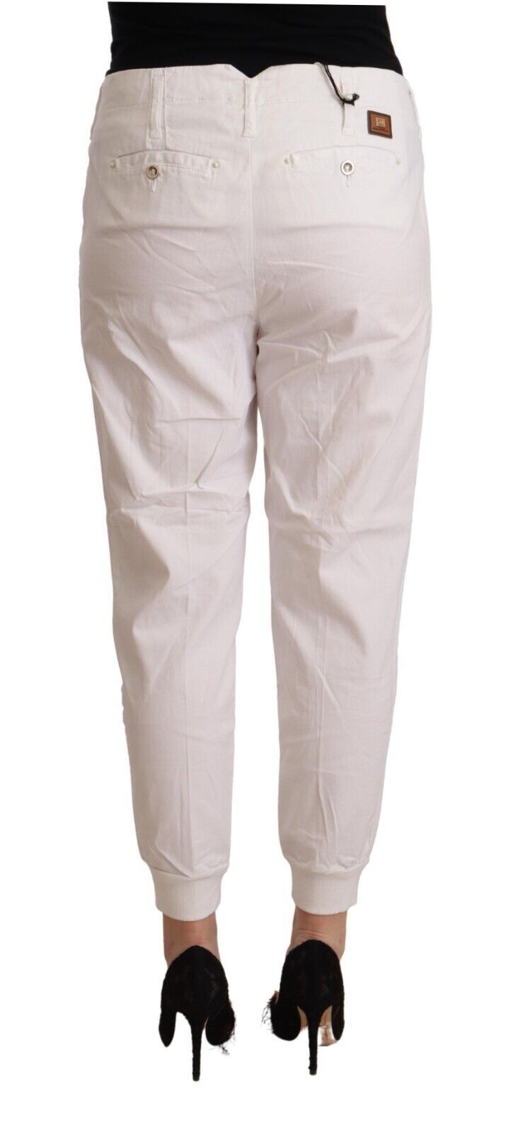 With chic white tapered cropped pants